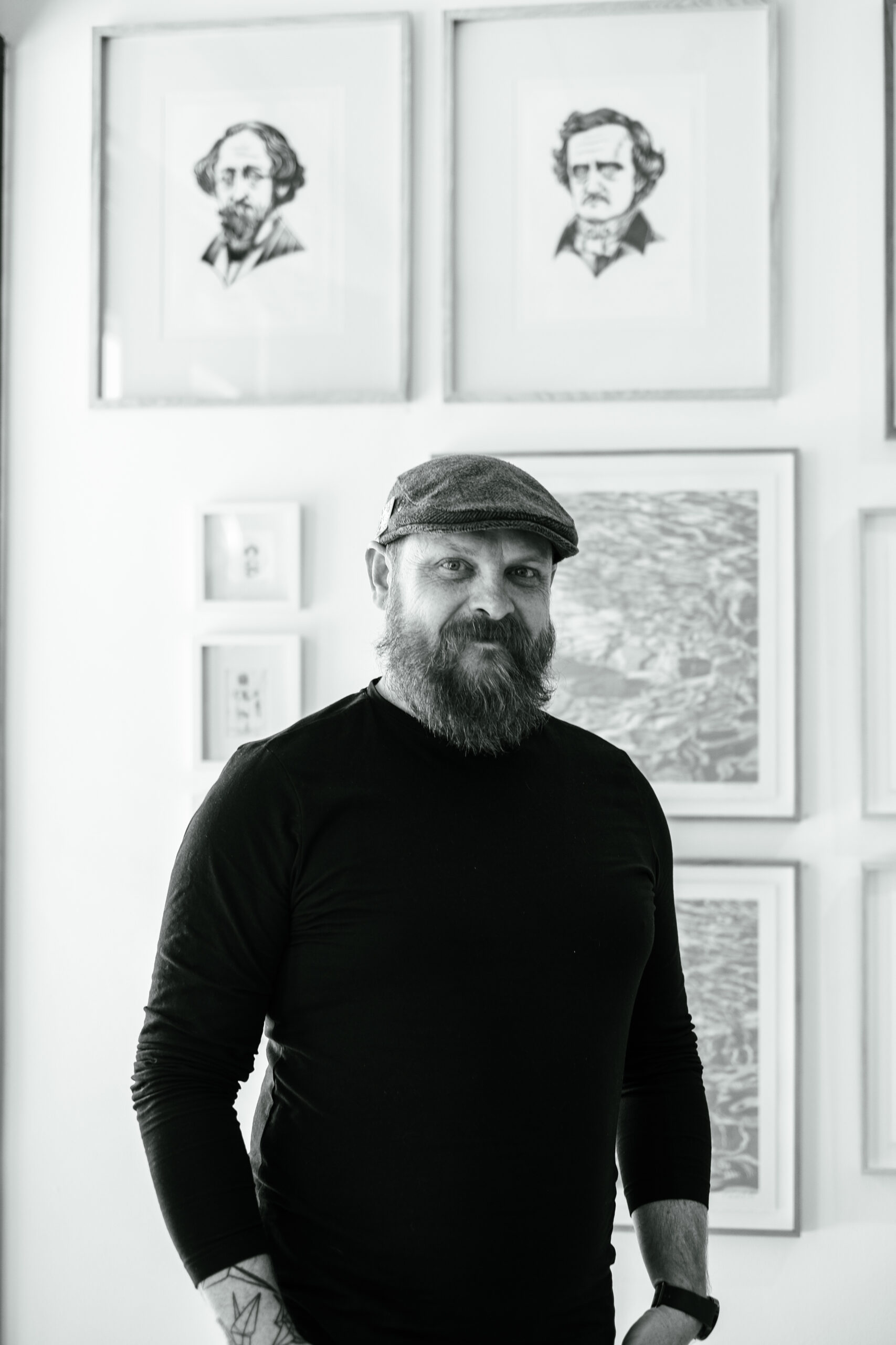 Man photographed infant of his art at a gallery showing in Johannesburg by a photographer who photographs small businesses and people.